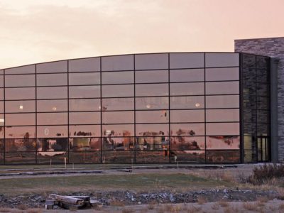 Glass curtain wall on pre-engineered metal building