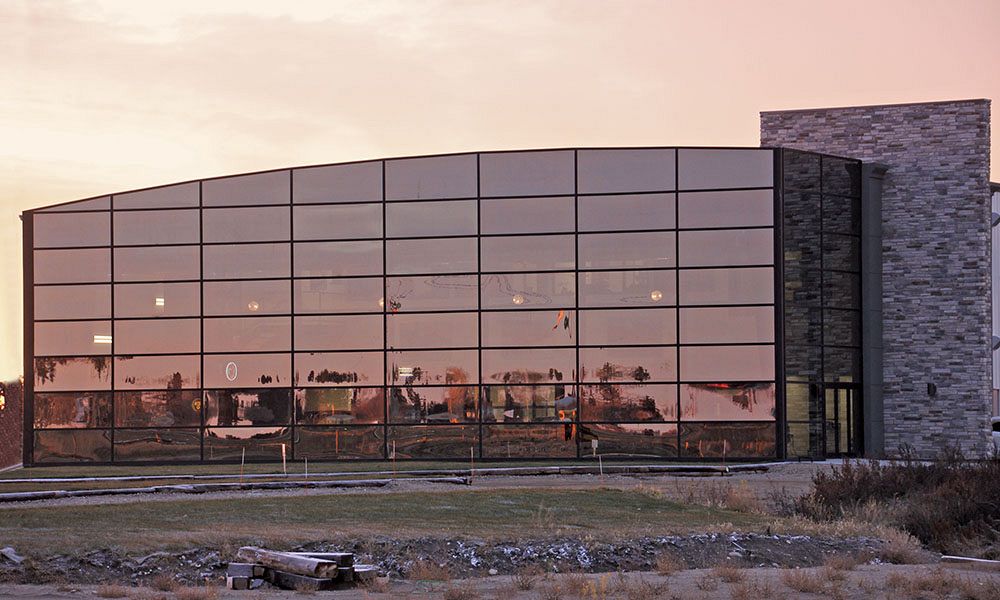 Glass curtain wall on pre-engineered metal building