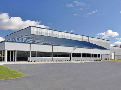 Hipped lean-to on manufacturing building