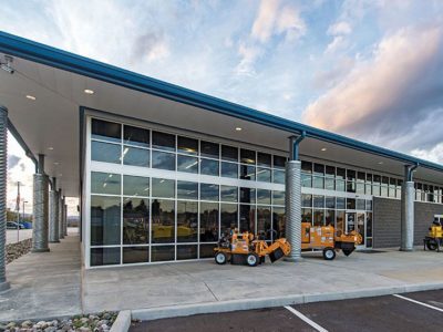 Custom designed equipment sales building with roof overhangs