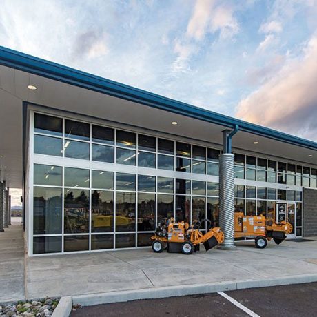 Custom designed equipment sales building with roof overhangs