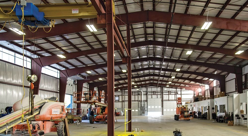 Interior of equipment repair facility with crane