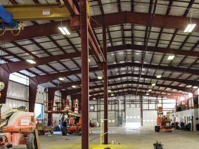 Interior of equipment repair facility with crane