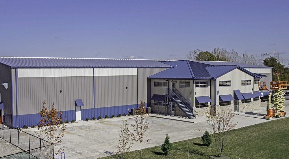 Office with full mezzanine attached to equipment repair building