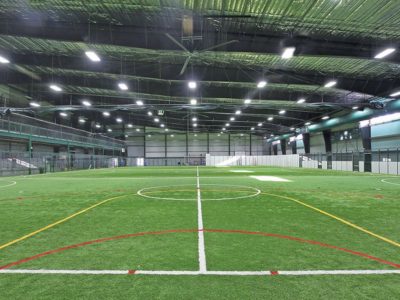 Soccer field interior of athletic steel building