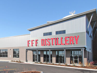 Five-building distillery addition with all single slope design