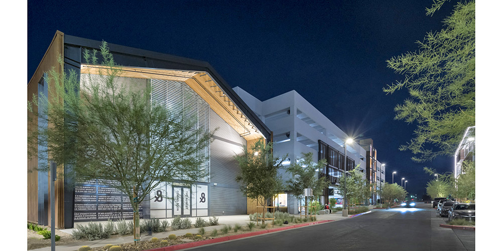 Steel building complex of offices, retail, markets, and cafe