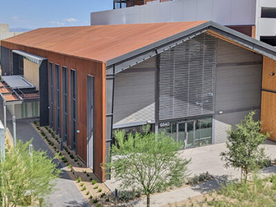 Steel building complex of offices, retail, markets, and cafe